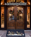 Doormat with festive fishing and winter motifs in front of ornate wooden doors.
