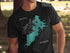 Black t-shirt with teal Watson Lake map and compass graphic.