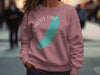 Pink sweatshirt with Carlyle Lake Illinois map and compass graphic.