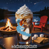 Cold drink with whipped cream, fire pit, lake, and s'mores ingredients.