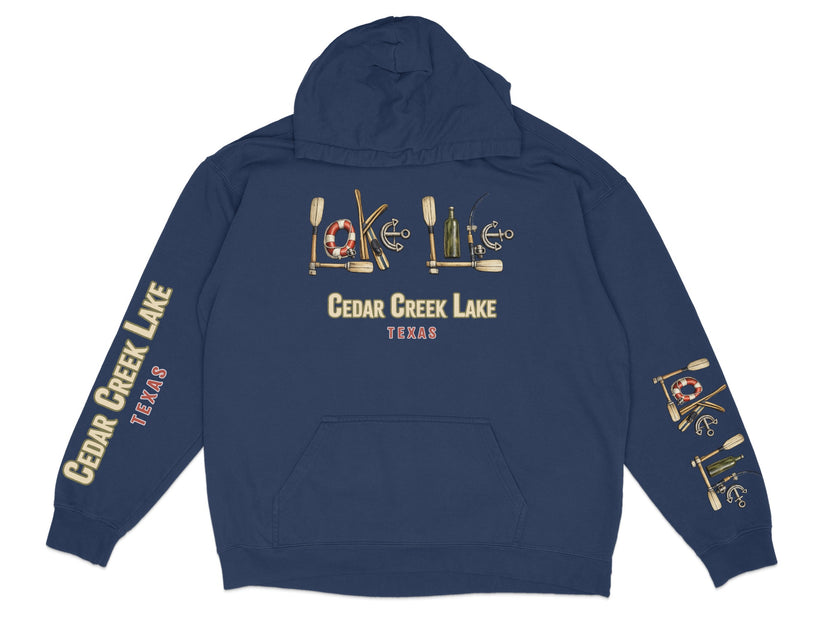 Navy hoodie with "Cedar Creek Lake Texas" and nautical graphics on chest and sleeves.