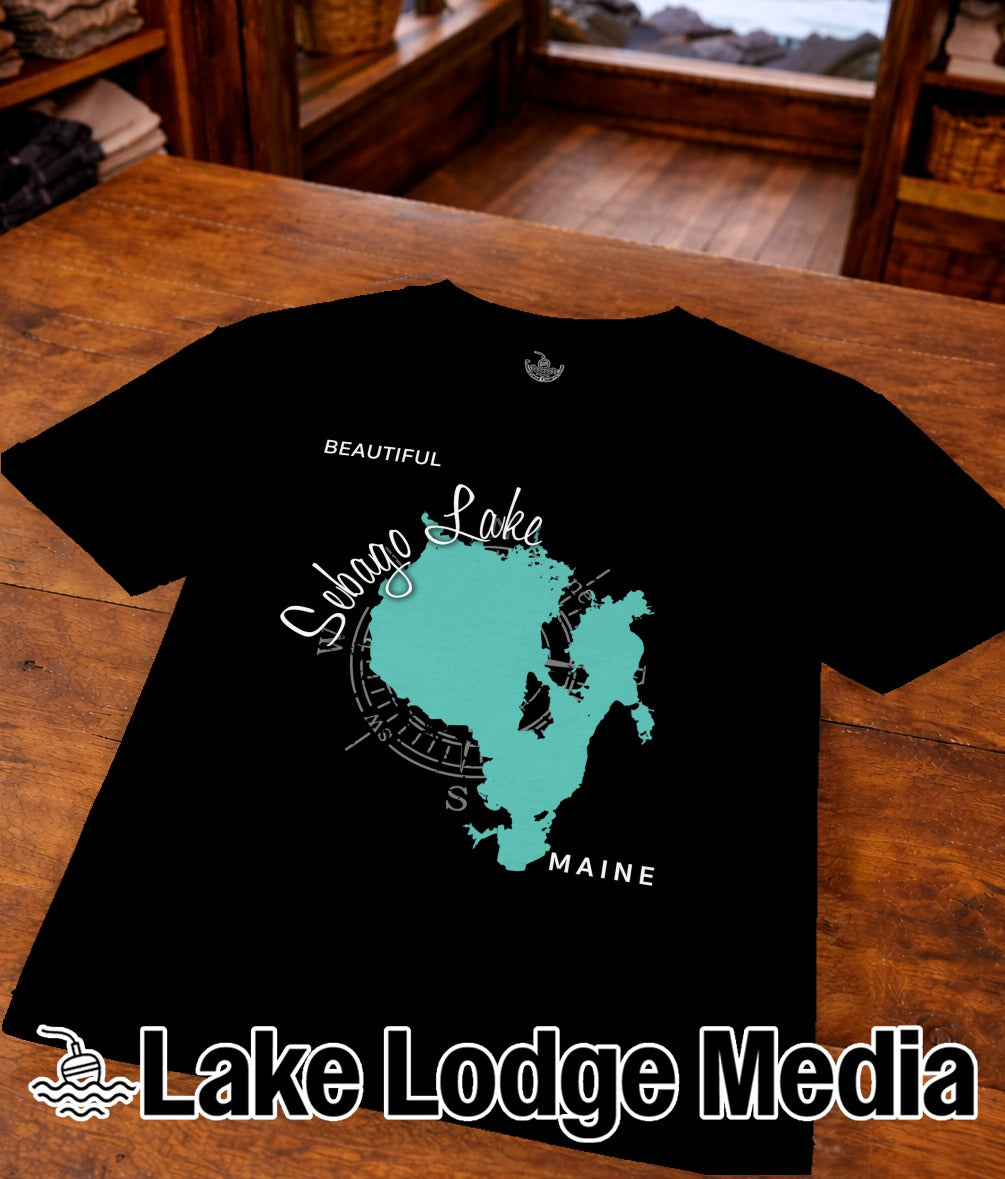 Black t-shirt featuring a teal map of Sebago Lake, Maine, with "Lake Lodge Media" text.