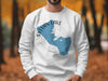 White sweatshirt with Sylvan Lake, South Dakota outline and compass graphic.