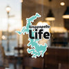Turquoise Wappapello Life sticker with black text on a glass surface.