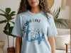 Light blue t-shirt with Medina Lake Texas map and compass graphic.