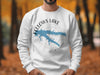 White sweatshirt with Fellows Lake, Missouri map and compass graphic.