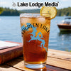 Glass with iced tea, lemon slice, and "Evergreen Lake" design.