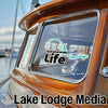 Sakakawea Life sticker on a boat window with Lake Lodge Media logo below.