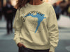 Cream sweatshirt with Rushford Lake, New York graphic and compass design.