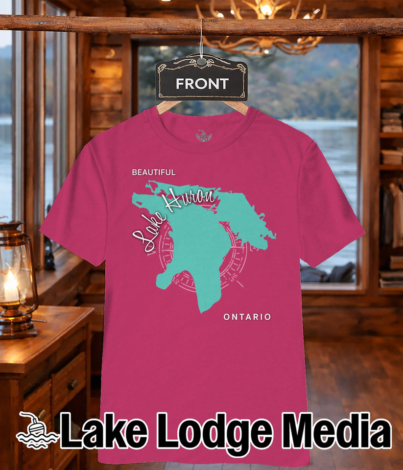 Pink t-shirt with teal Lake Huron outline and "Lake Lodge Media" text.