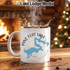 White mug with "Pine Flat Lake California" design, hot coffee splashing, fireplace and Christmas tree background.