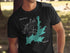 Black t-shirt with Hayden Lake Idaho map and compass graphic.