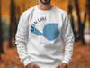 White sweatshirt with blue Glen Lake Michigan map graphic and compass.