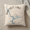 Cream pillow with blue Mitchell Lake map, compass, and Alabama text.