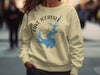 Tan sweatshirt with a blue Lake Jocassee map and compass graphic.
