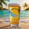 Glass of beer on a beach with "Lake Kabatogama" text and a Minnesota map.