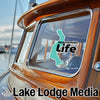 Teal Sammamish Life sticker on boat window, with Lake Lodge Media logo.