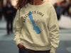 Light beige crewneck sweatshirt with Keechelus Lake, Washington map and compass graphic.