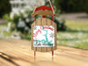 Red and wood sled ornament with "Merry Christmas From Lake Harding" text.