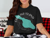 Black t-shirt with teal Catalina Island graphic and compass, "CALIFORNIA" text.