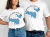 White t-shirts featuring "Brooks and Hess Lake Michigan" with blue lake outlines.