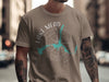 Brown t-shirt with a compass design showing Lake Mead and Arizona.