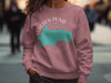Dusty rose crewneck sweatshirt with Walden Pond, Massachusetts map and compass graphic.