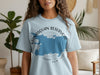 Light blue t-shirt with Manasquan Reservoir map and New Jersey text graphic.