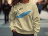 Light tan sweatshirt with blue Lake Erie map and compass graphic, text "LAKE ERIE ONTARIO".