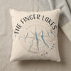 Cream pillow with "The Finger Lakes New York" text and compass and lake graphics.