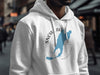 White hoodie with a graphic of Snow Lake Washington and a compass.
