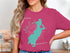 Pink t-shirt with teal outline map of Lake Quinsigamond, Massachusetts.