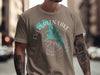 Taupe t-shirt with Evergreen Lake map design and compass rose graphic.