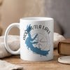 White mug with blue Arkabutla Lake map and compass design, "MISSISSIPPI" text.