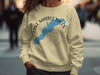Cream sweatshirt with Lake Marble Falls TX graphic and compass rose.