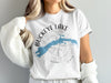 White t-shirt with a blue map of Buckeye Lake, Ohio featured within a compass design.