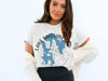 White t-shirt with 'Lake Massabesic Hampshire' text and blue map graphic.