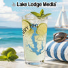 Glass of lime and mint cocktail with lake map graphic on beach background.