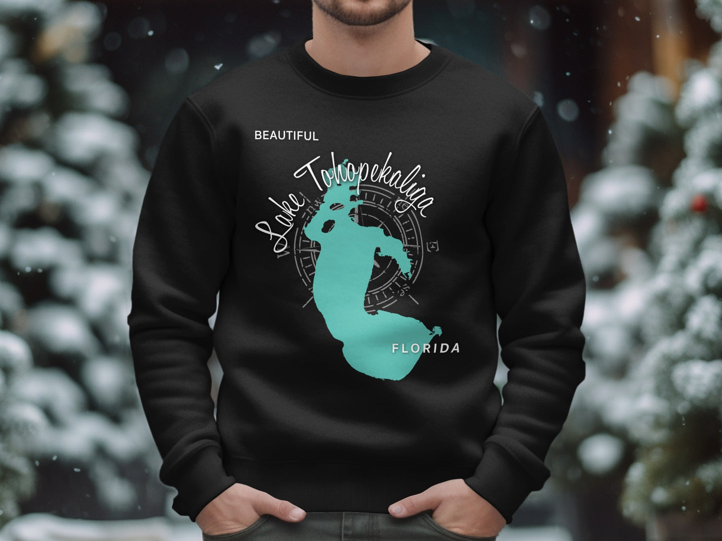 Black crewneck sweatshirt featuring a teal outline of Lake Tohopekaliga, Florida.