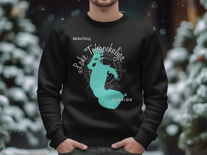 Black crewneck sweatshirt featuring a teal outline of Lake Tohopekaliga, Florida.