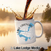 White mug with "Lake Lahontan Nevada" map and compass graphic being filled with coffee.