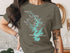 T-shirt featuring a stylized compass and Lake Norman, North Carolina map graphic.