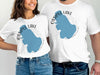 White t-shirts with blue Ossipee Lake map graphic and compass.