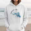 White hoodie with a blue map of Canyon Lake, Texas, and compass design.