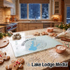 A glass cutting board featuring a compass design and Folsom Lake map sits on a kitchen counter.