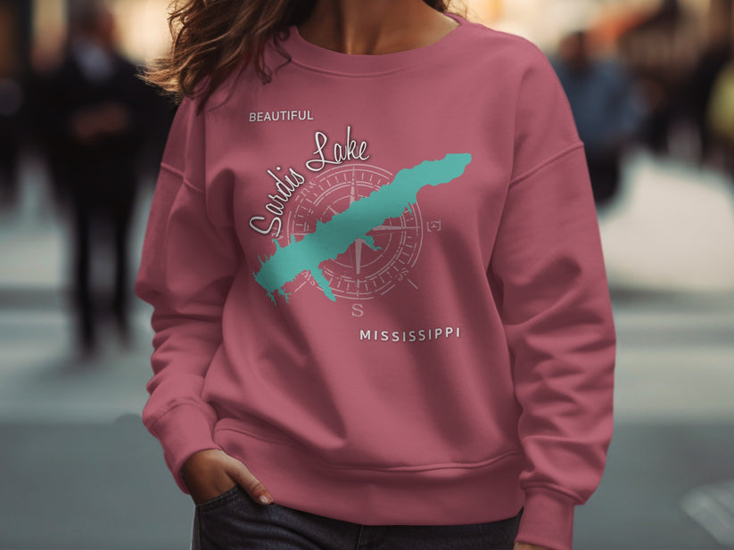 Pink sweatshirt featuring a turquoise outline of Sardis Lake, Mississippi, and a compass rose.