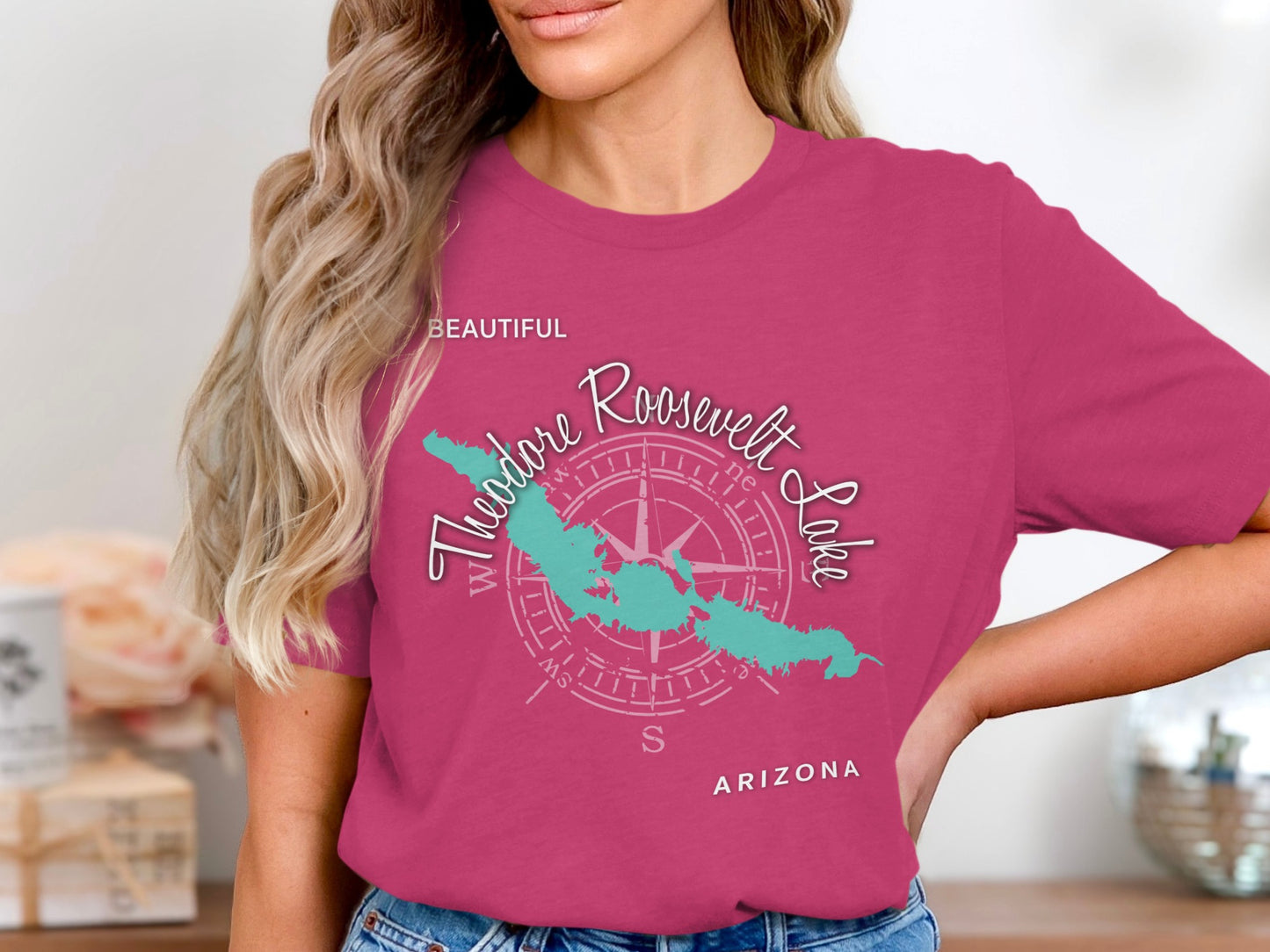 Teal Theodore Roosevelt Lake graphic on a pink t-shirt.