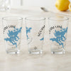 Three clear pint glasses with blue Squam Lake maps and compass designs.