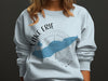Light blue crewneck sweatshirt with Lake Erie and compass graphic and "OHIO" text.
