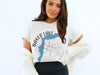 White t-shirt with "Baker Lake Washington" text and compass graphic